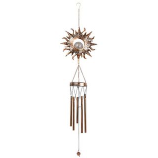 A wind chime with a solar sun decoration