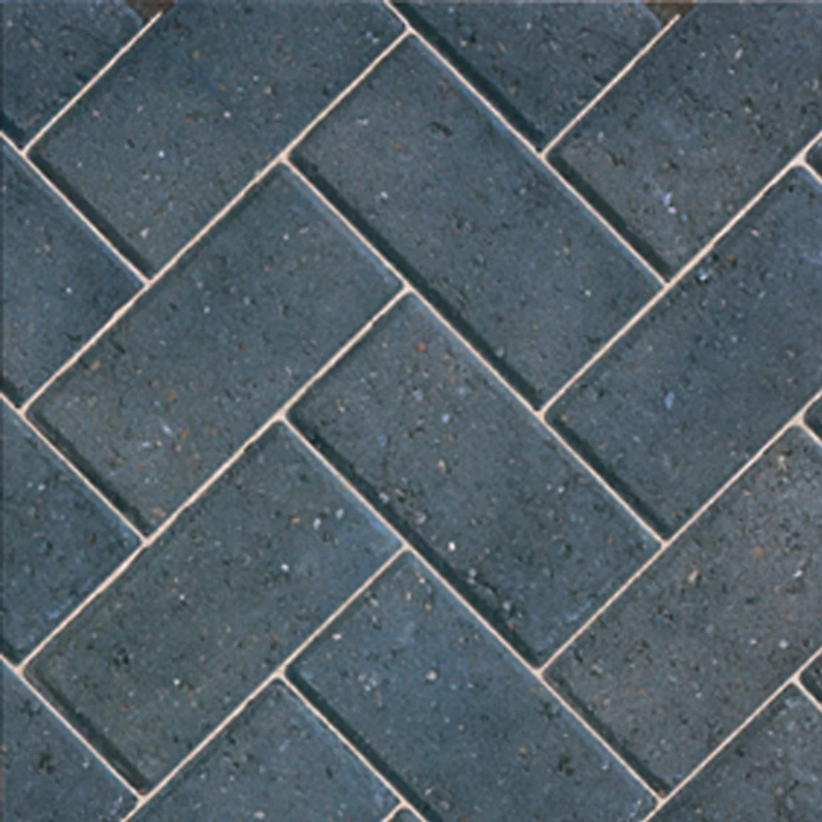 Dark charcoal block paving in a herringbone formation 