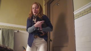 Erika Christensen as Angie holding Betty the dog in Will Trent