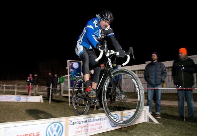 Adam Craig bunny hops the barriers.