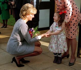 Princess Diana greets a little girl in 1995