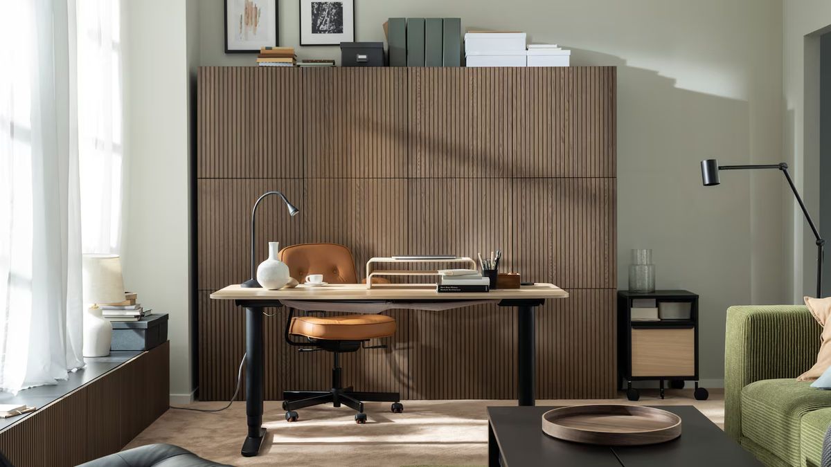 home office with wooden cupboards behind desk and chair