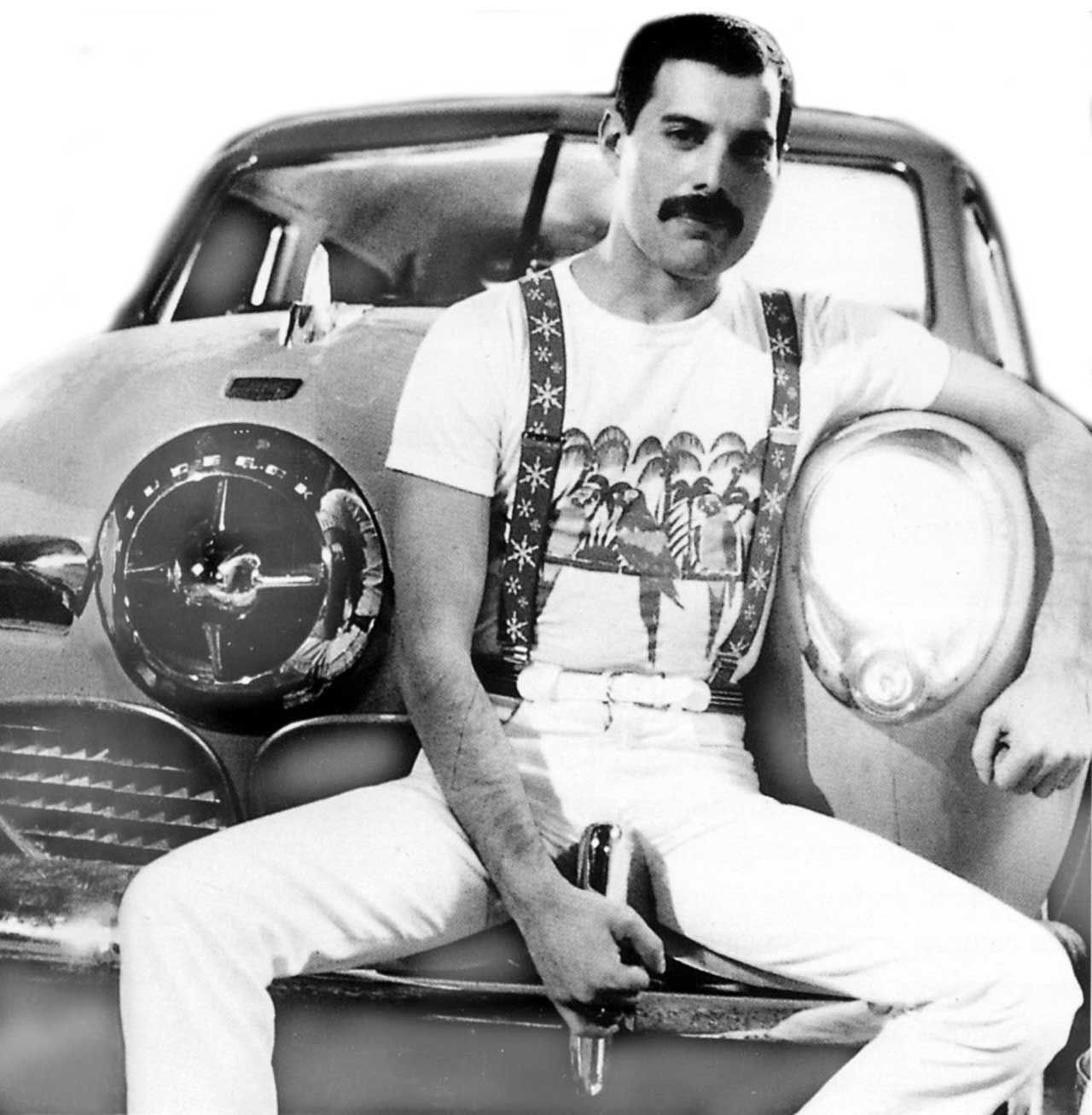 Freddie Mercury makes himself comfortable at front end of the suitably-named 1950 Studebaker Champion