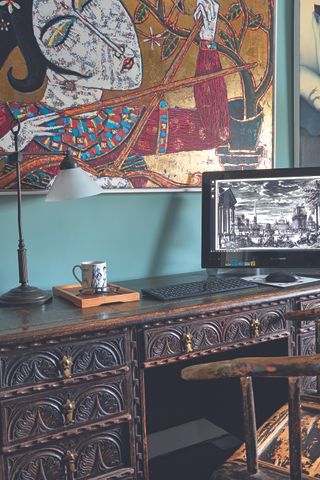 Home office with chinese art and carved table