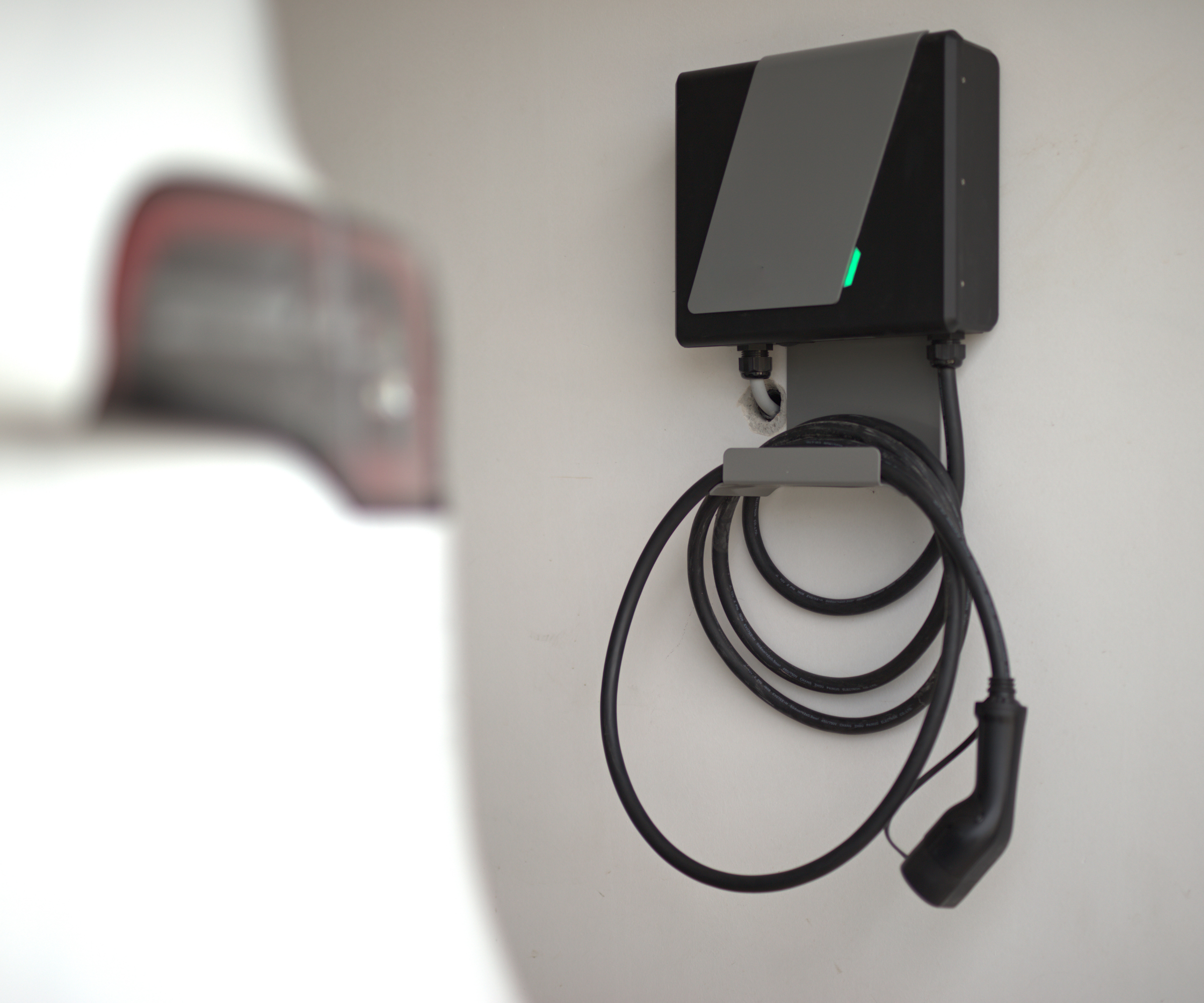 EV chager with cord wrapped around the hook