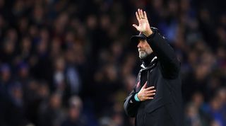 Jurgen Klopp applauds the Liverpool fans after the Reds' 3-0 defeat to Brighton.