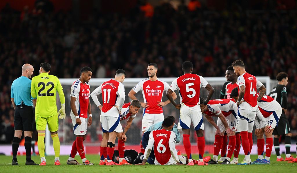 Gabriel of Arsenal receives medical treatment after picking up an injury during the Premier League match between Arsenal FC and Liverpool FC at Emirates Stadium on October 27, 2024 in London, England. 