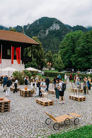 People outside at a Nils Holger Moormann design event