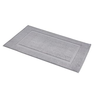 A grey rectangular bathmat with a smaller rectangle imprint detail towards the center.