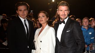 Brooklyn Beckham, David Beckham and Victoria Beckham together in suits back in 2019.
