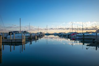 Sunrise skyline over the shore side harbor near Lake Michigan's West Grand Traverse Bay in Traverse City, Michigan.