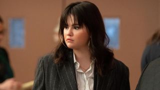 Selena Gomez looking slightly concerned to the left in Season 3 of Only Murders in the Building.