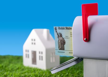 US Treasury check in an open mailbox. Government checks are used to disburse income tax refunds as well as Social Security and Medicare benefits.. The distinctive green checks feature an engraving of the Statue of Liberty and the Treasury Seal. The government checks are used to disburse income tax refunds as well as Social Security and Medicare benefits.