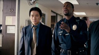 Jackie Chan and Chris Tucker standing in a hospital hallway during a conversation in Rush Hour 3.