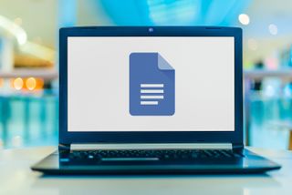 Google Docs logo on a laptop screen, representing an article about how to change case in Google Docs