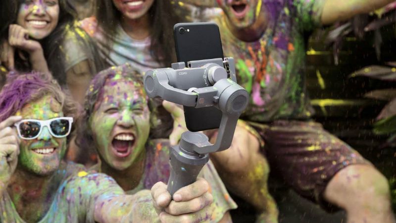 People covered in paint with a DJI osmo