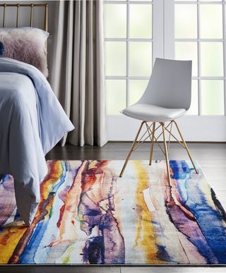 Watercolor design rug in a bedroom