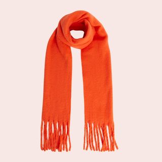 Flat lay image of orange scarf 