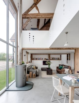 Living room with high ceilings and concrete floors