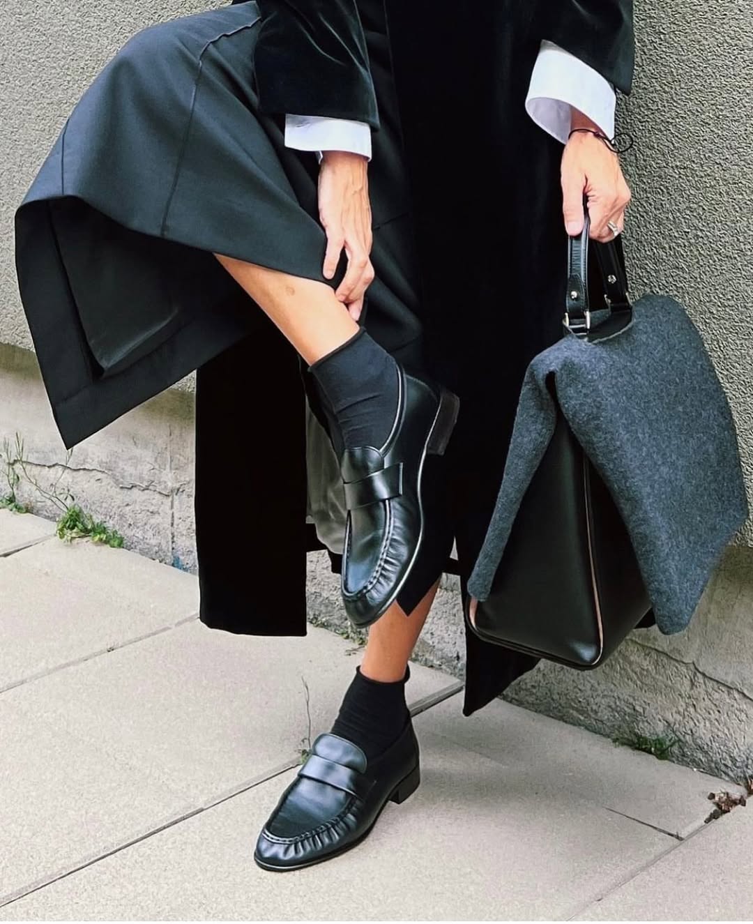 @neelam.ahooja wears The Row's soft eel loafers in black