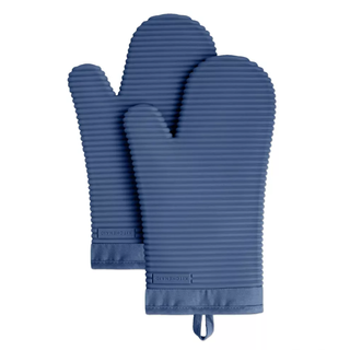 a pair of blue silicone oven gloves with a horizontal ribbed texture and ribbon to hang up