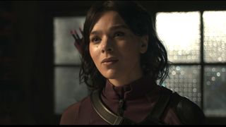 Kate Bishop in her purple suit looking confused speaking to Ms Marvel in The Marvels.