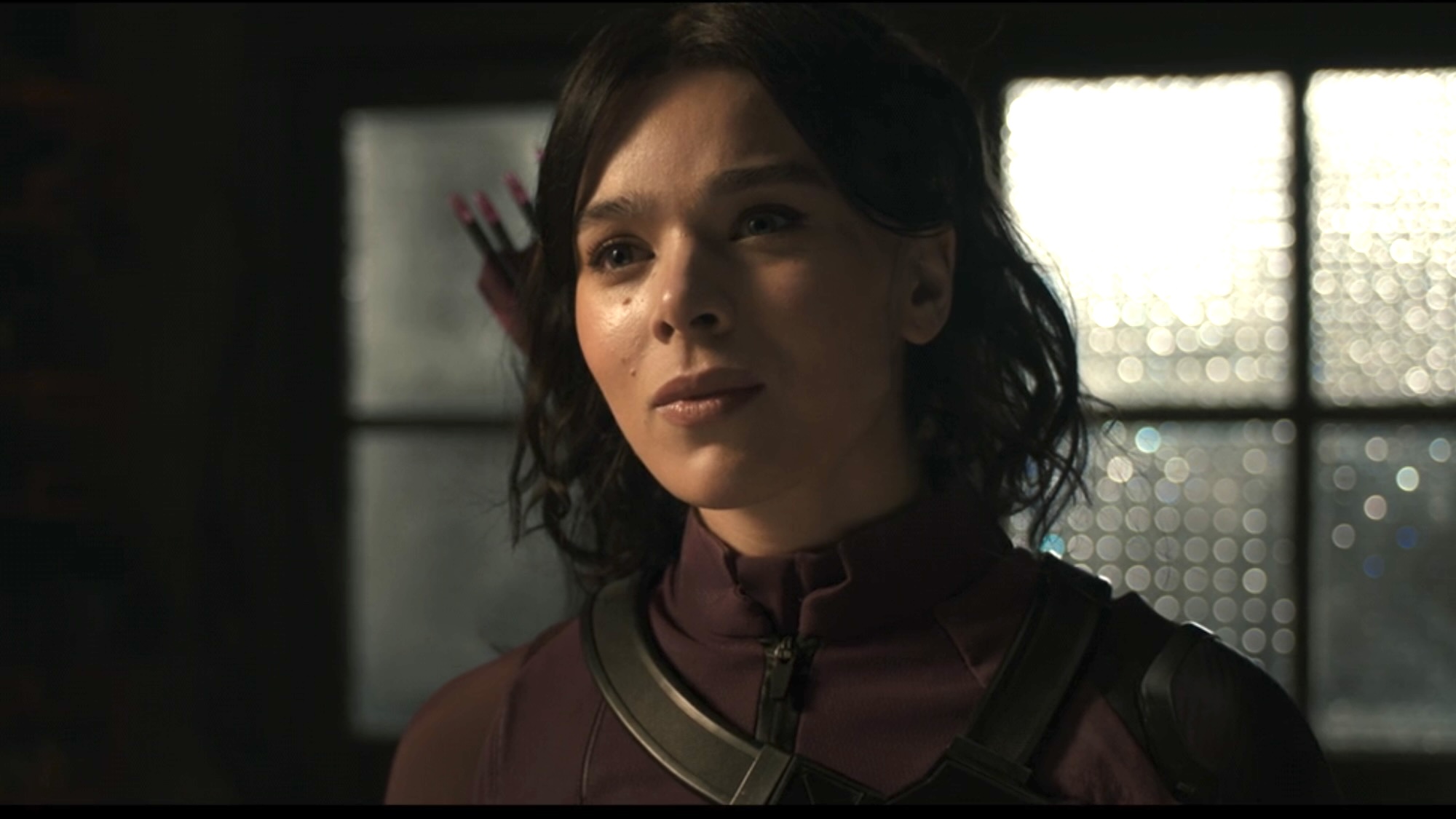 Kate Bishop in her purple suit looking confused speaking to Ms Marvel in The Marvels.