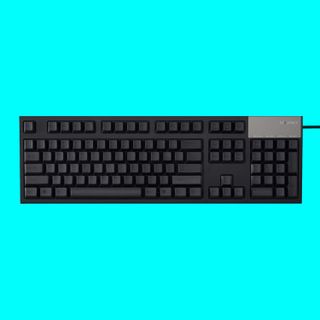 The Topre Realforce R2 keyboard on a light blue background