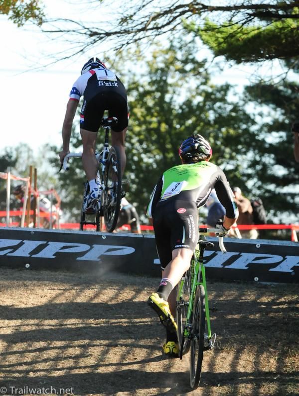 Jeremy Powers (Rapha Focus) hops the barriers while Tim Johnson dismounts on lap three