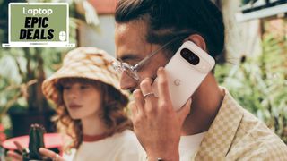 Man holding porcelain white Pixel 9 phone to ear