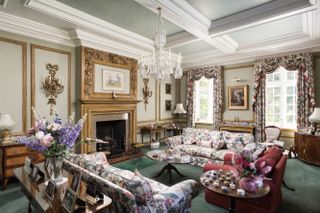 Ornate drawing room with floral sofas