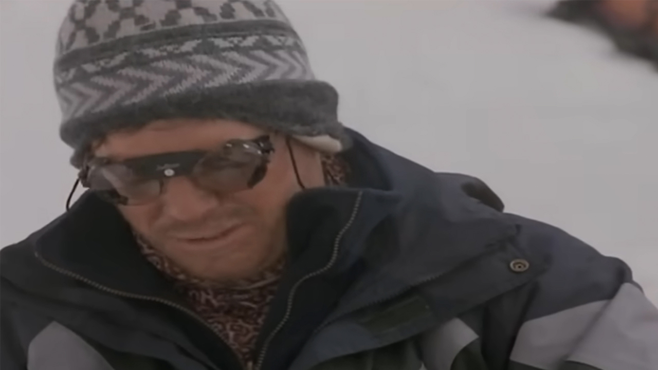 A character in cold weather gear in Into Thin Air: Death on Everest