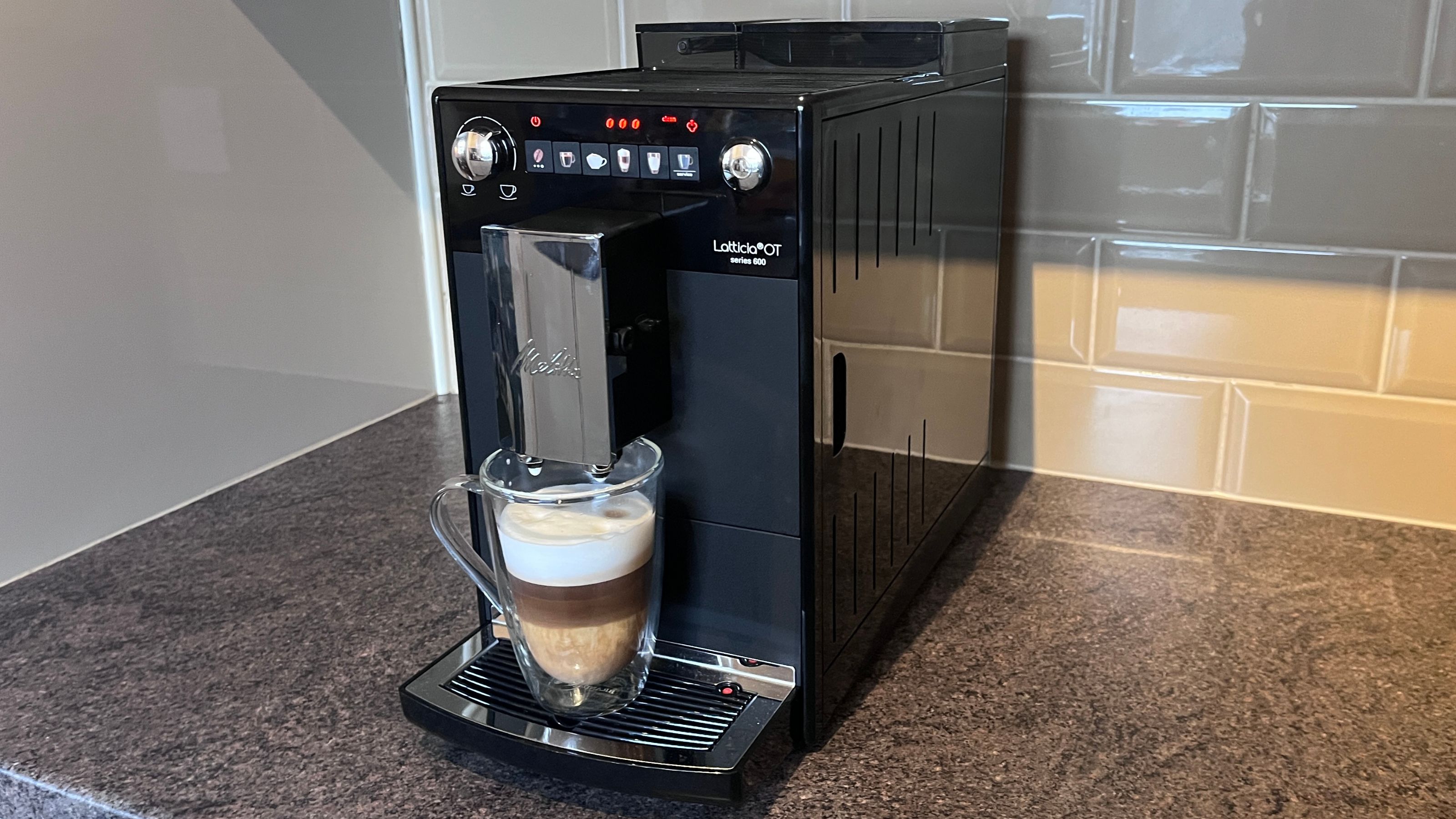 A Melitta Latticia OT Bean-to-Cup Coffee Machine making a latte
