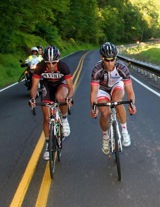 Trying to bridge the gap, Jacob Mueller (Stan's Notubes p/b Proferrin) leads Andrew Seitz (Panther Bakehouse) rounding the curve.