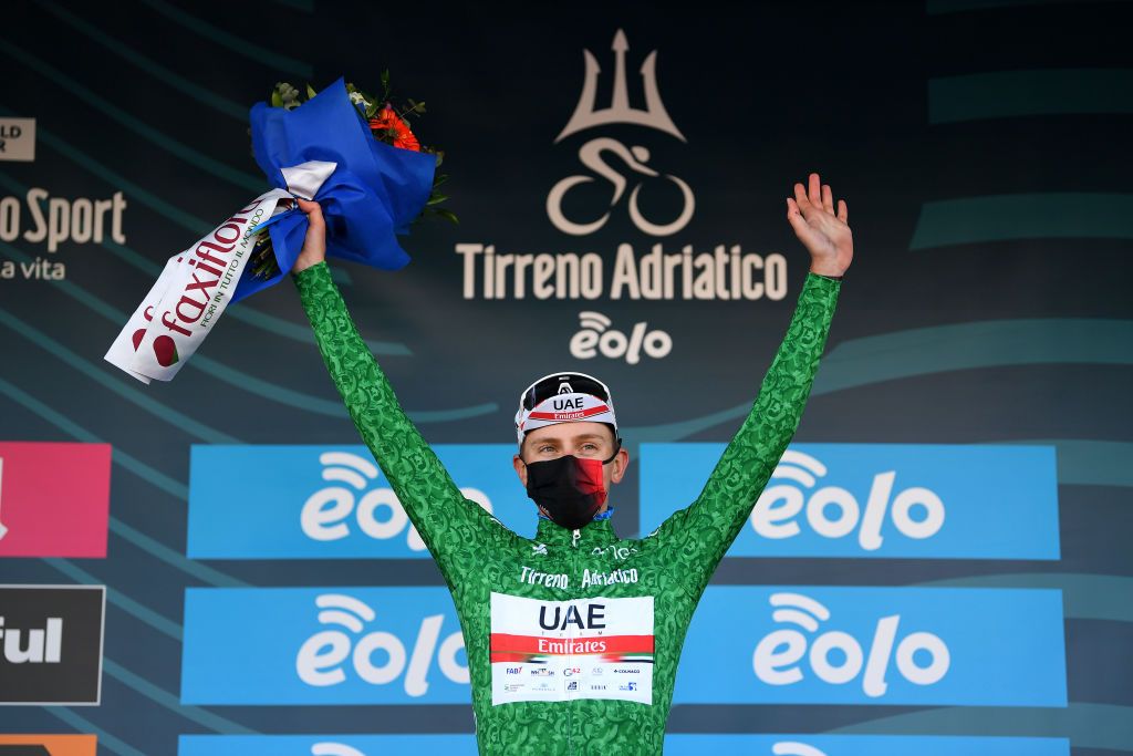 LIDODIFERMO ITALY MARCH 15 Podium Tadej Pogacar of Slovenia and UAE Team Emirates Green Mountain Jersey Celebration during the 56th TirrenoAdriatico 2021 Stage 6 a 169km stage from Castelraimondo to Lido di Fermo Mask Covid safety measures Flowers TirrenoAdriatico on March 15 2021 in Lido di Fermo Italy Photo by Tim de WaeleGetty Images