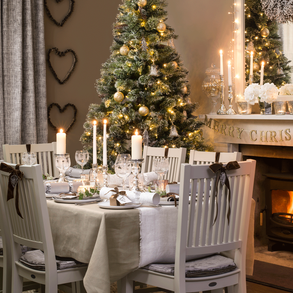 white dinning table and white chair and christmas tree