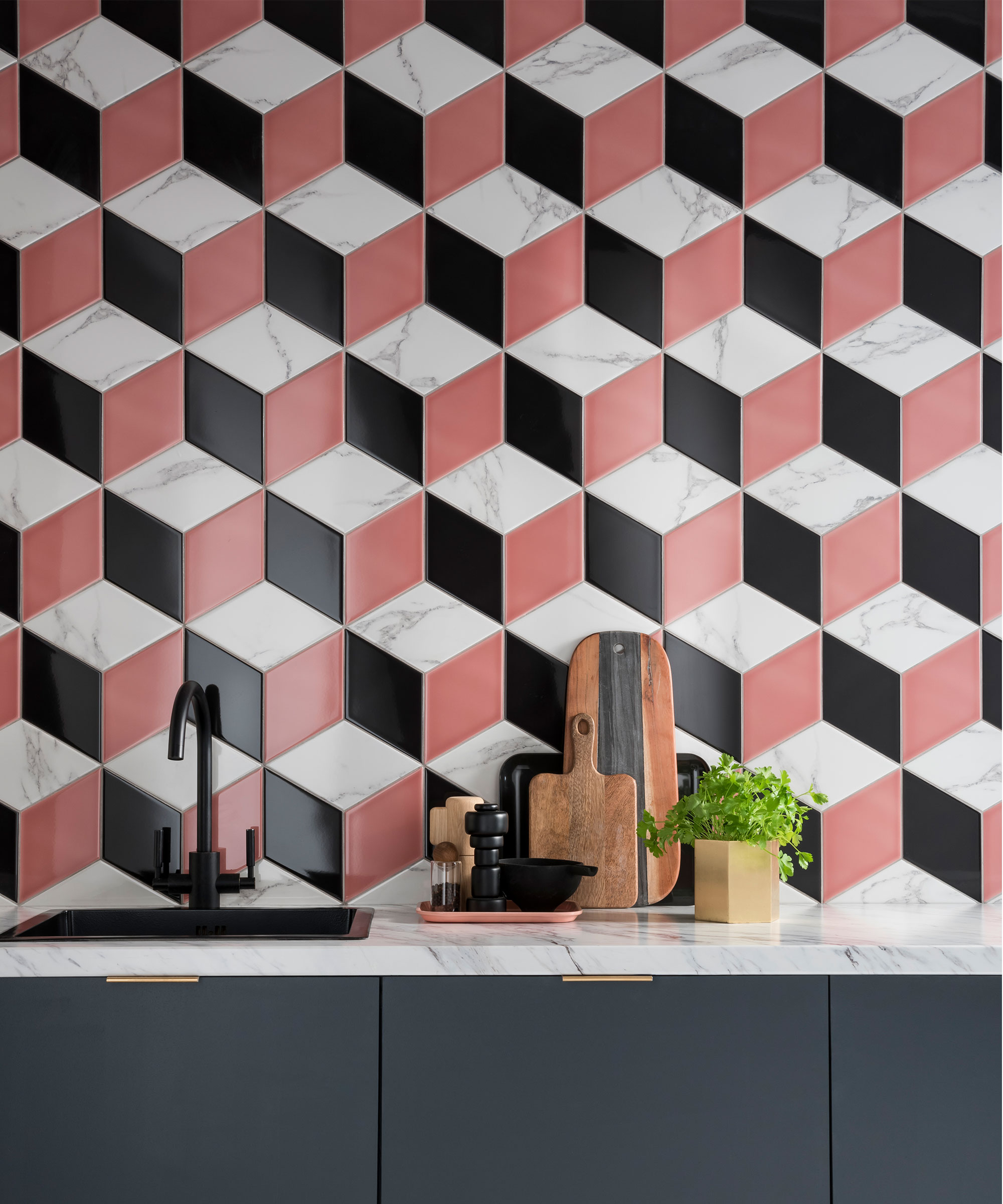 Rhomba hexagonal black and white tiles with bright coral accent illustrating tile trends 2021.