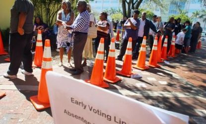 People wait in line to vote at the North Miami Public Library in Miami, Fla., on Nov. 1.