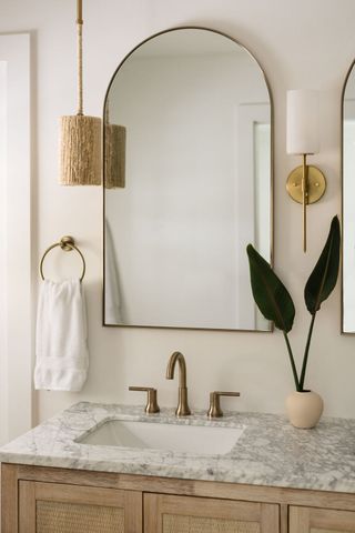 A bathroom with woven lights