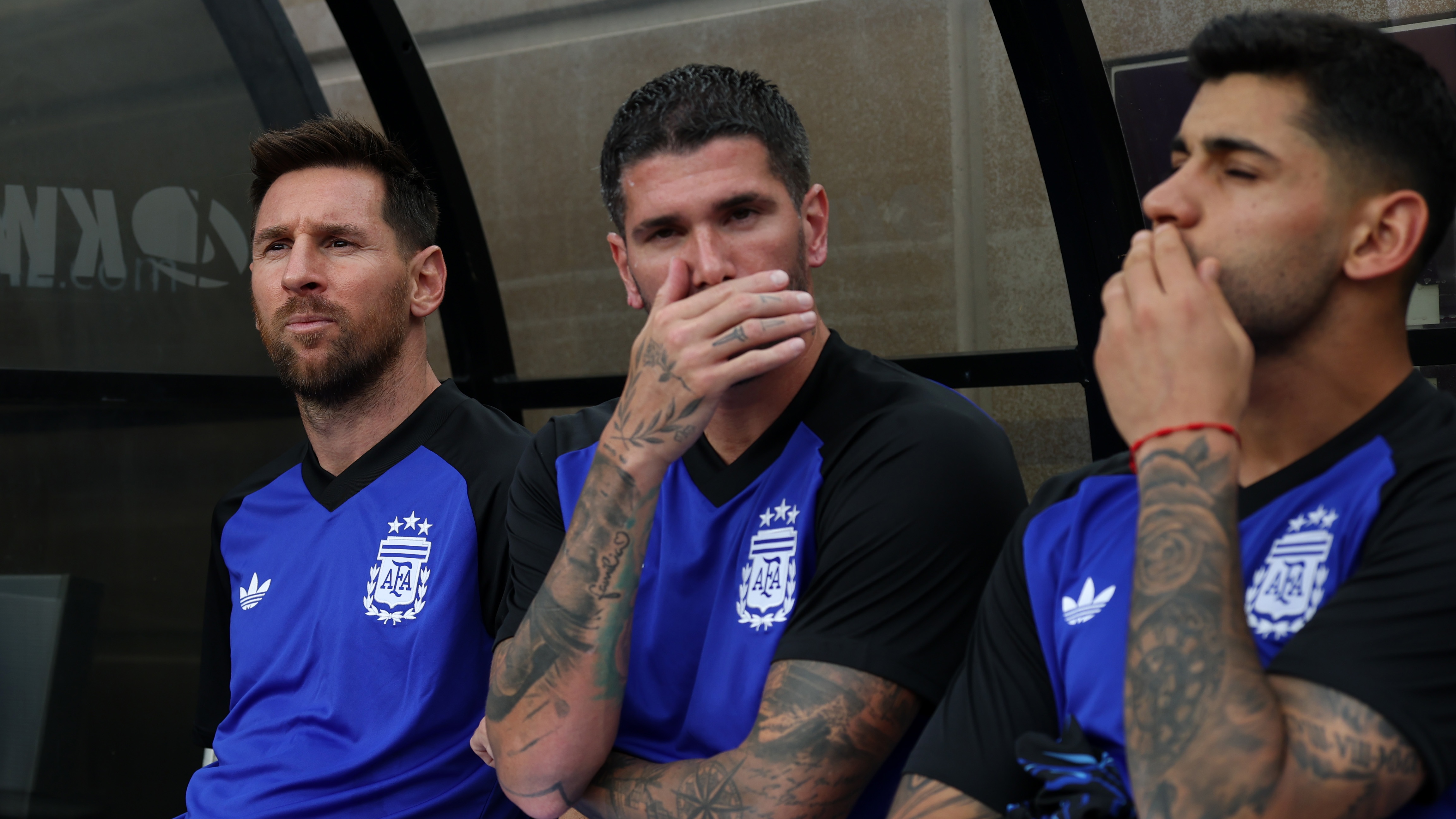 Messi looks on from the bench