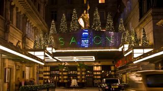 Exterior view of The Savoy hotel, London, with Christmas trees