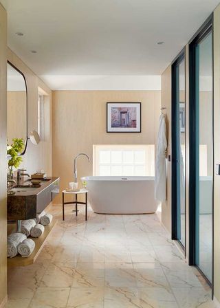 an image of the guest bathroom with the bath iand sink in view
