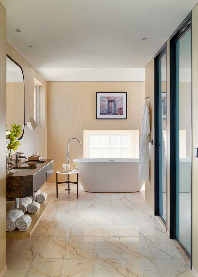 an image of the guest bathroom with the bath iand sink in view
