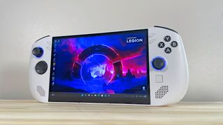 The Lenovo Legion Go S standing upright on a wood table