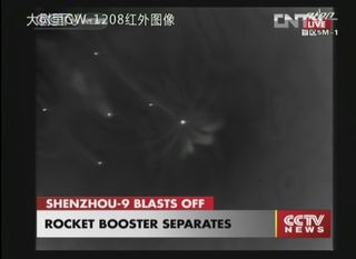 This spectacular view shows the rocket boosters separating as planned from China's Long March 2F rocket during the successful launch of Shenzhou 9 on June 16, 2012.