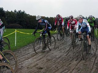 The elite men in four inches of thick mud on the first lap.
