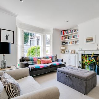 sitting room with sofa set and crisp white wall