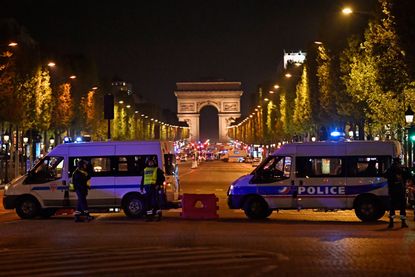 French police secure an area after a shooting in Paris