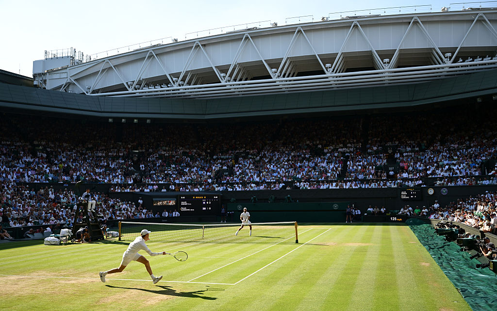 A general view over Centre Court as Jannik Sinner of Italy plays a forehand against Novak Djokovic of Serbia