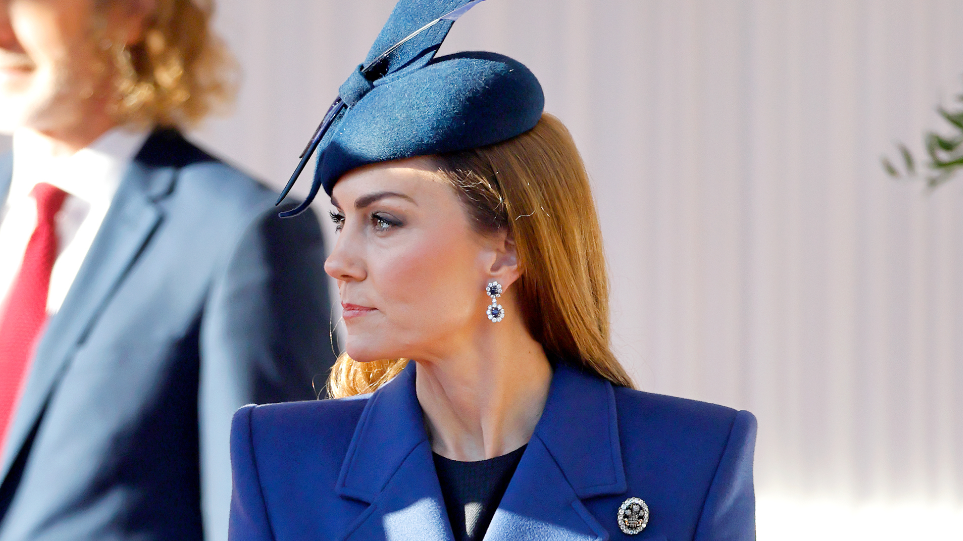 Kate Middleton wearing a blue coat and hat